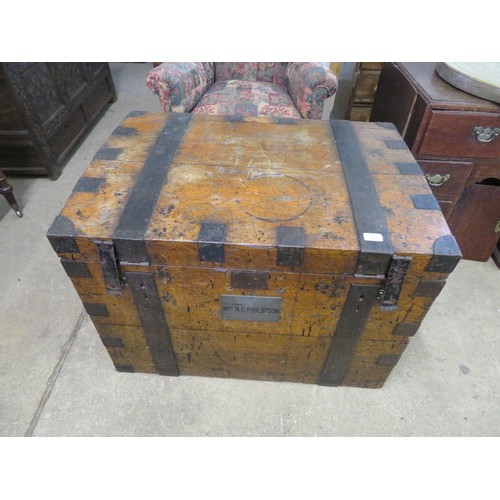 753 - An antique oak travelling trunk with iron banding and corner brackets with plaque inscribed David Cr... 