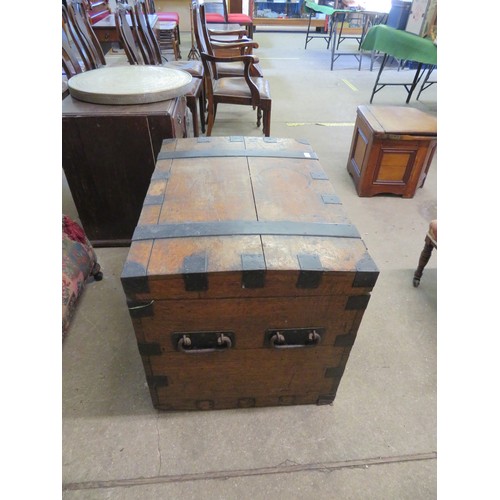 753 - An antique oak travelling trunk with iron banding and corner brackets with plaque inscribed David Cr... 