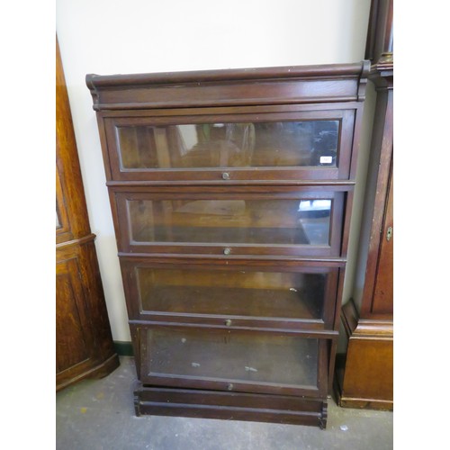 757 - An antique oak cased Globe Wernike Bookcase with four shelves. 155cm high x 92cm wide.