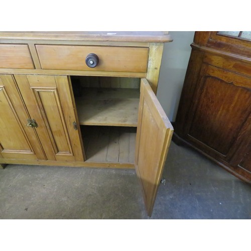 759 - An antique pine dresser with fitted top having four drawers and shaped back with 2 drawers and cupbo... 