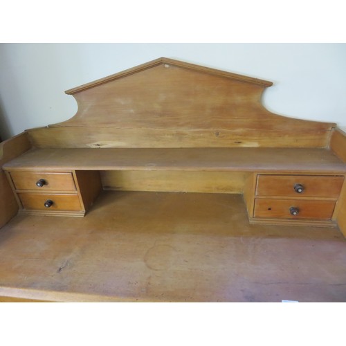 759 - An antique pine dresser with fitted top having four drawers and shaped back with 2 drawers and cupbo... 