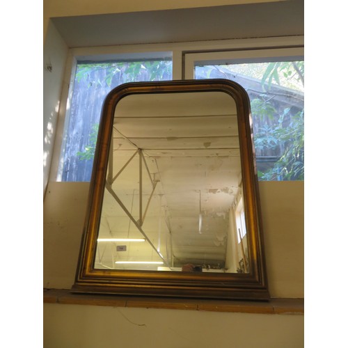 760 - A gilt frame bow topped over mantle mirror measuring 93cm high x 70cm wide.