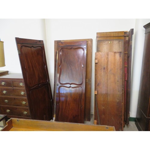 767 - An antique mahogany double wardrobe with shaped decorative panels and inlaid decoration.