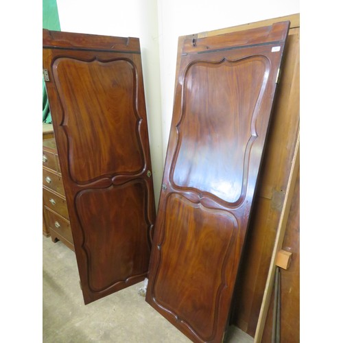 767 - An antique mahogany double wardrobe with shaped decorative panels and inlaid decoration.