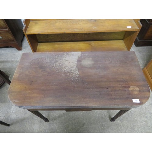 769 - An antique mahogany fold over tea table on reeded legs.