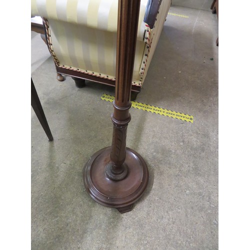 781 - A mahogany standard lamp with reeded column and circular base on 3 feet.