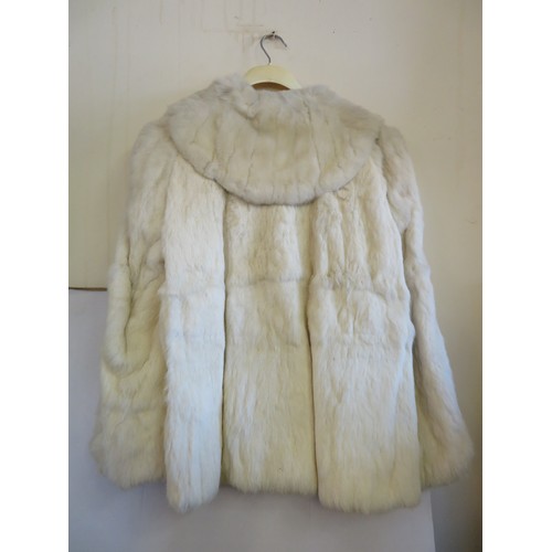 683 - A vintage white fur jacket.