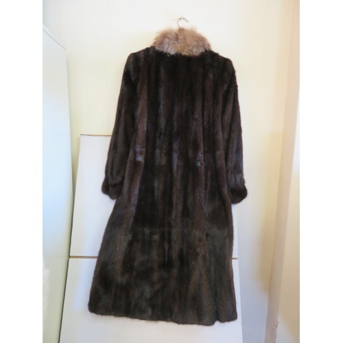 684 - A vintage brown fur coat with a 