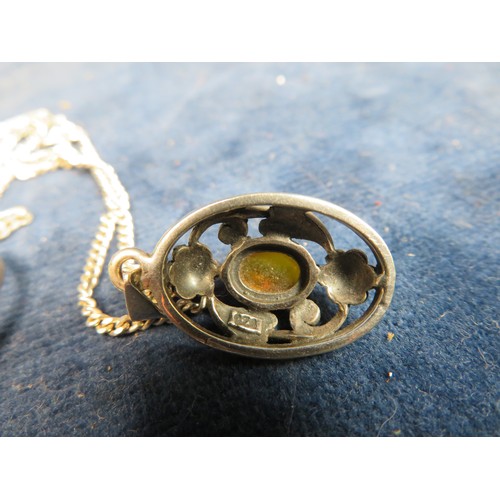 690 - An art nouveau style pendant and chain set with amber stone and marked 925, and a similar ring set w... 