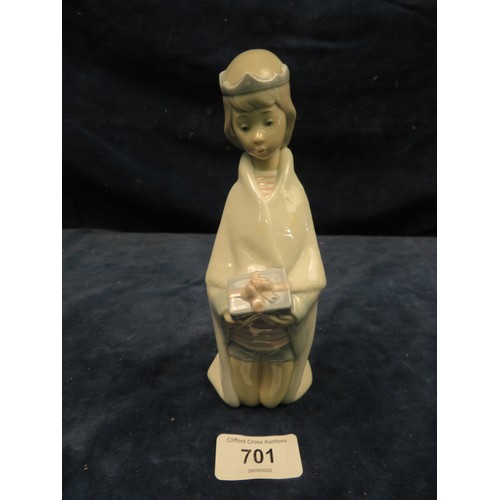 701 - A Lladro figurine of a kneeling prince holding a gift.