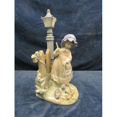 711 - A Lladro figurine of a girl under gas lamp with sweeping brush.