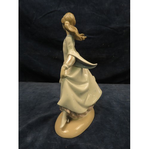 716 - A Lladro figurine of a girl dressed in medieval costume with one slipper removed.