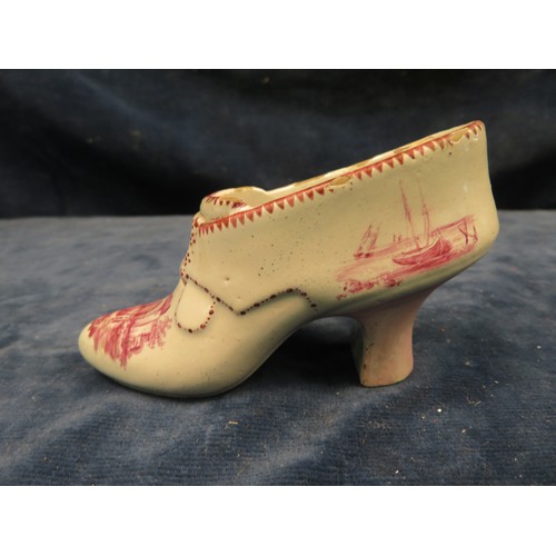 724 - A most unusual 18th century Dutch pottery shoe with hand painted castle ruin, boat and sea shore sce... 