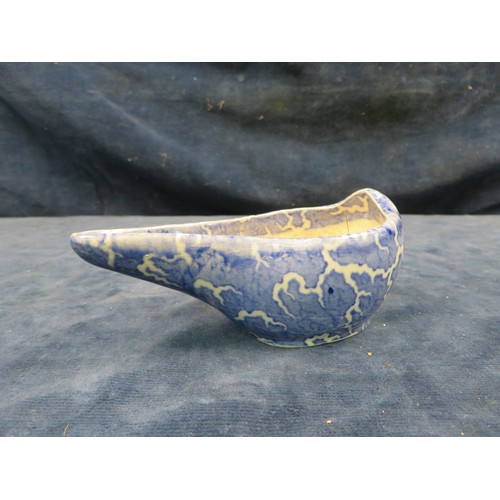 726 - An early 19th century Staffordshire Pottery pap boat with blue mottled hand-painted decoration.