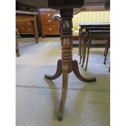 787 - An oak single drop leaf table on turned pedestal with 3 splayed legs.