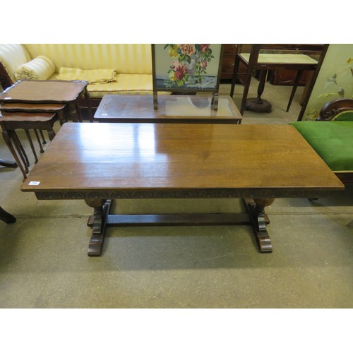 790 - An oak side table on baluster and stretcher base with carved decoration.