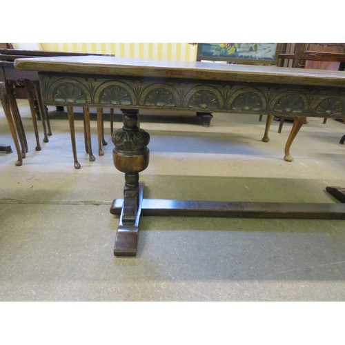 790 - An oak side table on baluster and stretcher base with carved decoration.