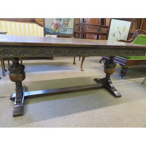 790 - An oak side table on baluster and stretcher base with carved decoration.