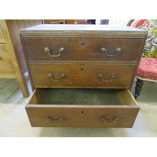 792 - An oak chest of 3 drawers on castors A/F.