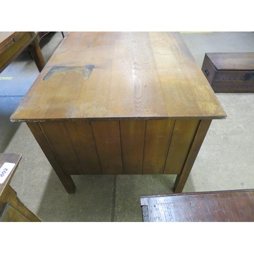 794 - An oak desk with slides and 5 drawers.