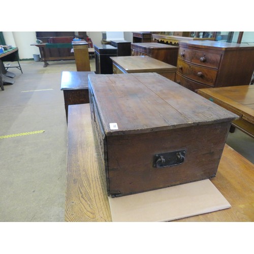 795 - An unusual antique trunk with carved front panel and 2 iron carrying handles, 70.5cm x 44.5cm x 28cm... 