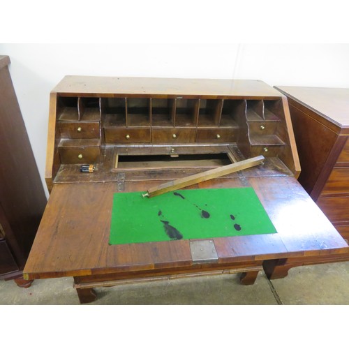 798 - An antique mahogany bureau desk with inlaid decoration having fitted interior and inset baize with 2... 