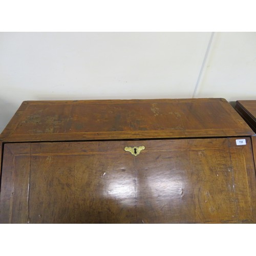 798 - An antique mahogany bureau desk with inlaid decoration having fitted interior and inset baize with 2... 