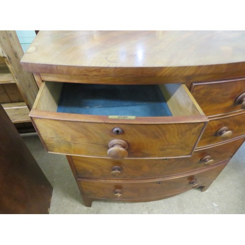 801 - An antique mahogany bow fronted chest of 2 short and 3 long drawers with turned wooden handles on br... 