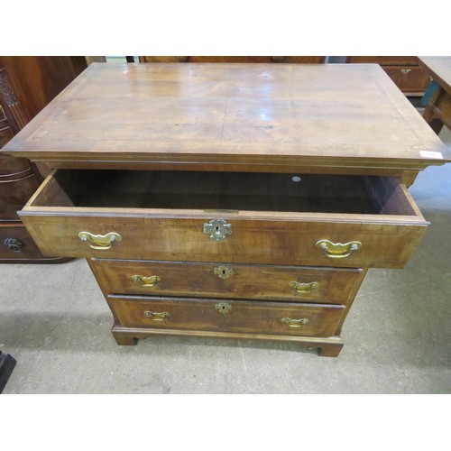 802 - An antique mahogany and inlaid chest of 4 long drawers with brass drop handles on shaped bracket fee... 