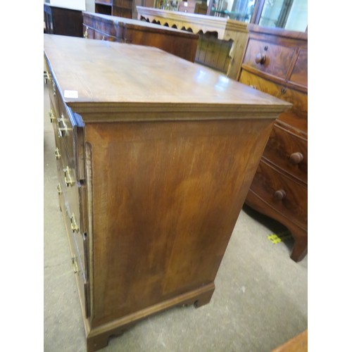 802 - An antique mahogany and inlaid chest of 4 long drawers with brass drop handles on shaped bracket fee... 