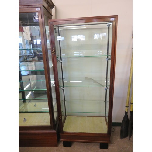 808 - A mahogany framed and glazed display unit with 3 glass shelves and fitted spot lights - 174.5cm wide... 