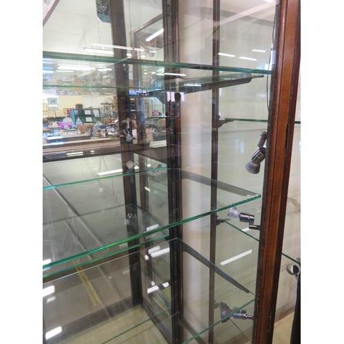 809 - A mahogany framed and glazed display unit with mirrored back and 4 glass shelves with fitted spot li... 