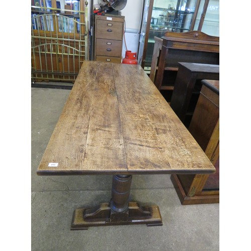 813 - An oak boarded table on baluster and stretcher legs - 213cm long x 81.5cm wide.