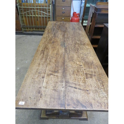 813 - An oak boarded table on baluster and stretcher legs - 213cm long x 81.5cm wide.