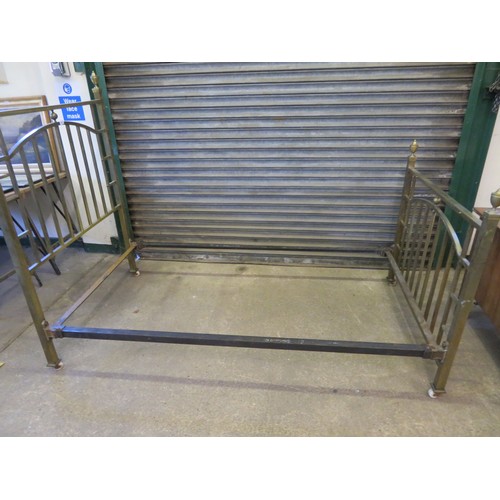 814 - A vintage brass single bed with head and foot boards having urn finial decoration.