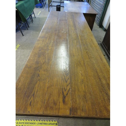 815 - An oak dining table - 206cm x 70.5cm.