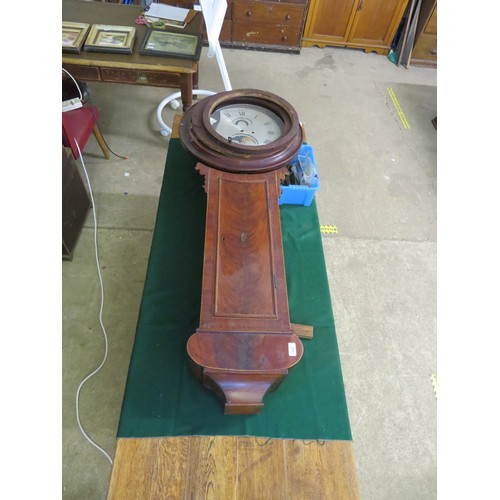 816 - An antique mahogany wall bracket clock with inlaid decoration and a circular dial and moon roller to... 