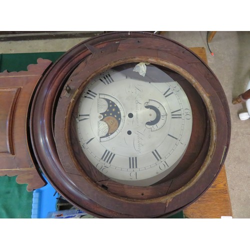 816 - An antique mahogany wall bracket clock with inlaid decoration and a circular dial and moon roller to... 