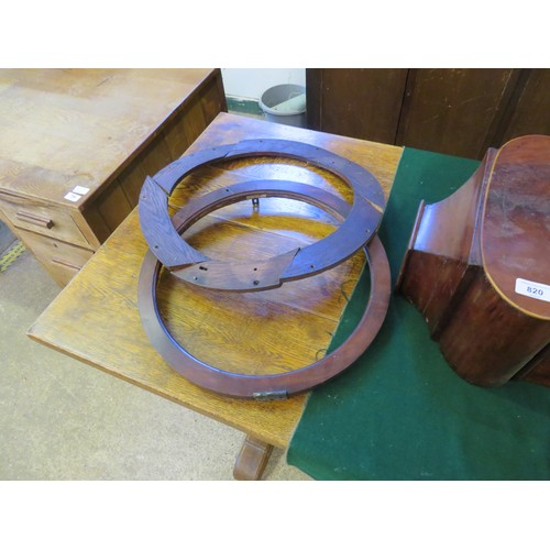 816 - An antique mahogany wall bracket clock with inlaid decoration and a circular dial and moon roller to... 