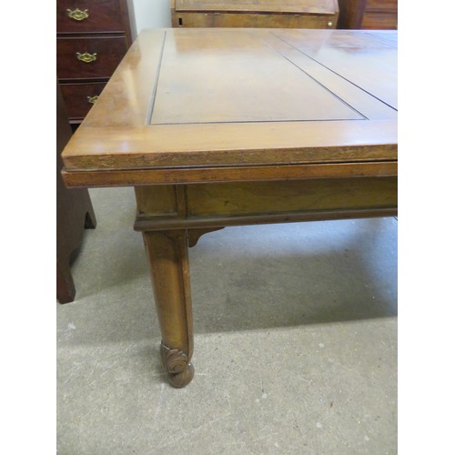 796 - An oak draw leaf dining room table on square and carved legs.