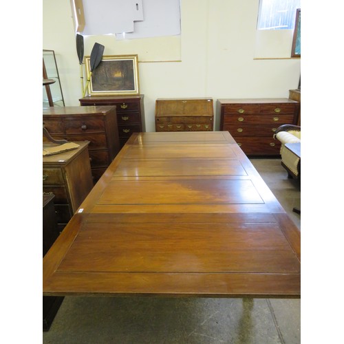 796 - An oak draw leaf dining room table on square and carved legs.