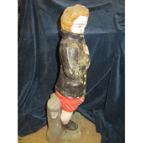 19 - A concrete and painted garden ornament of a boy 74cm tall.