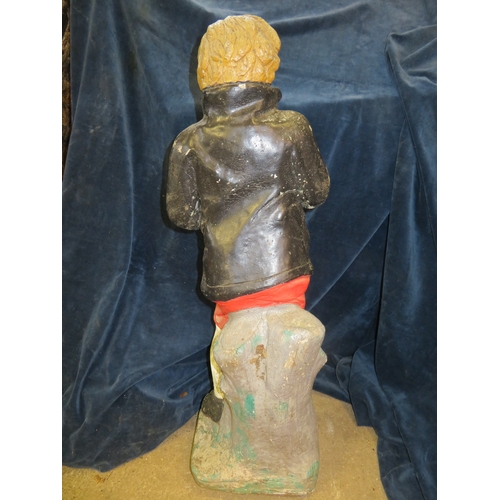 19 - A concrete and painted garden ornament of a boy 74cm tall.
