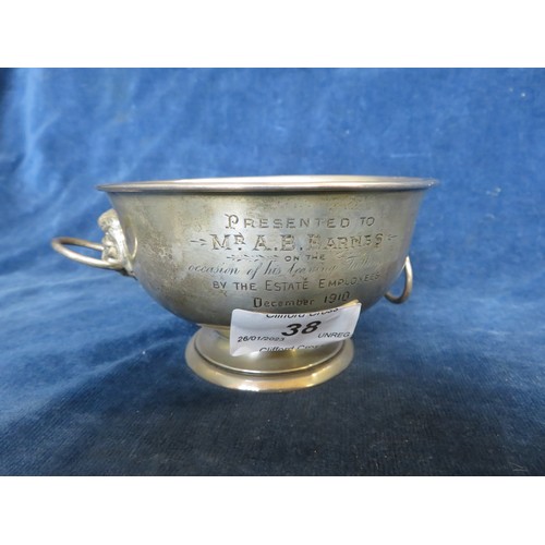 38 - A silver bowl with 2 lion head ring handles hallmarked London 1909 and engraved 'Presented to Mr. A.... 