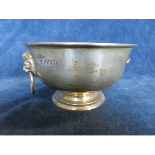 38 - A silver bowl with 2 lion head ring handles hallmarked London 1909 and engraved 'Presented to Mr. A.... 