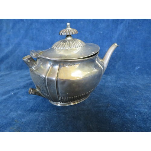 45 - A silver teapot with wooden finial hallmarked Sheffield by Pearce & Sons Ltd, Leeds, York and Leices... 