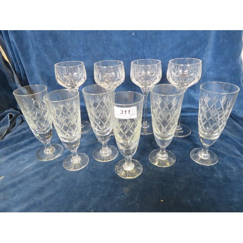 311 - Six cut glass champagne flutes, together with 4 hock glasses.