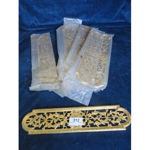 312 - Nine decorative brass finger plates.