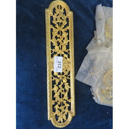 312 - Nine decorative brass finger plates.