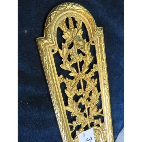 312 - Nine decorative brass finger plates.